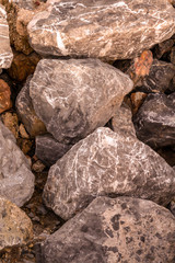 large gray brown uneven stone quarry vertical mural base hard weathered