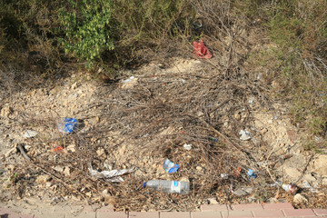 Litter and discarded plastic in a tourist town. Mazarron in Murcia, Spain.