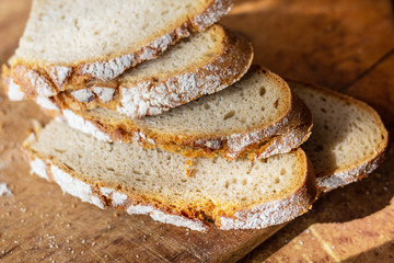 Slices of bread on a wooden board.