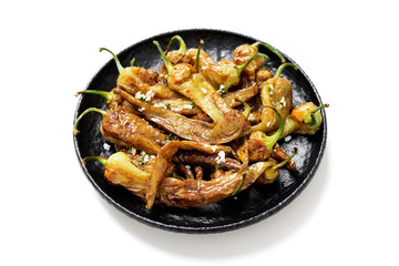 Fried green peppers  with garlic sauce and sea salt. isolated on white background