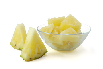 slice pineapple for eating in glass bowl