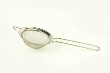 shiny colander on white background