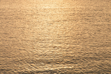 Sea surface. Calm down on the water. Texture a small ripple. Calm sea at sunset twilight