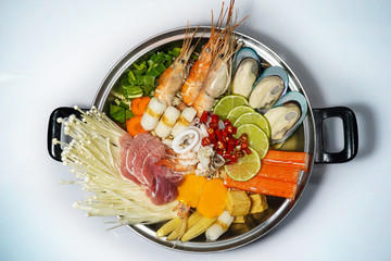 mixed thai spicy hot pot(tum yum) on white background , thai food.Hot pot soup