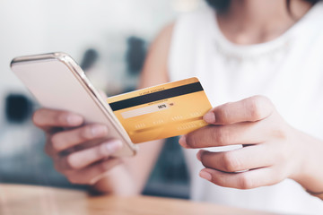 asian young business hands holding credit card and using laptop smart phone Online shopping Website,Article, Blog.Easy Ecommerce Website Shop Online by Smartphone.Online shopping concept