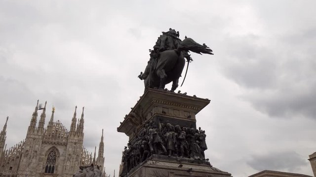 Pan Right to Left: Cathedral And Statue of Victory in the City of Milan Italy