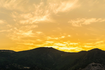 sunset bright sunny yellow light silhouette of the mountain long ridge background nature