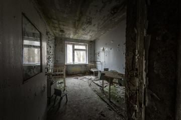 Fototapeta na wymiar Deserted Hospital room in Pripyat, Chernobyl Excusion Zone 2019