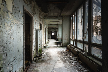 Fototapeta na wymiar Abandoned corridor in Pripyat Hospital, Chernobyl Exclusion Zone 2019