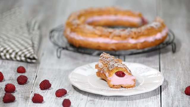 Paris-Brest choux pastry cake with whipped cream and berries. Close up. French dessert