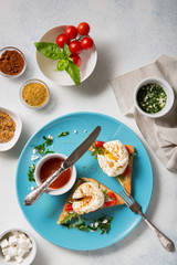 A traditional dish of French cuisine. Poached eggs with spices on a light background Top view