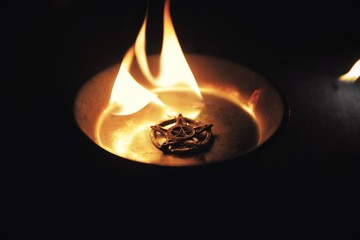 Old pentagram burning in flames