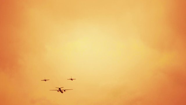 Armed russian fighter jets on the red sunset background