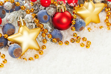 Christmas card with gold garland, stars, holly berries and glitter decor on white snow background