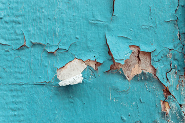Texture of cracked blue and brown wall background.