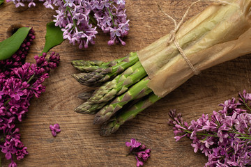 Organic fresh asparagus bunch, blooming lilac