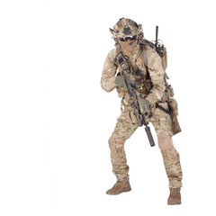 Army soldier crouching with rifle studio shoot