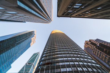 Fototapeta na wymiar Looking up at tall high skyscraper buildings in San Francisco in the Financial District, California