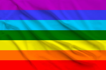 The rainbow flag, the symbol of the international movement for peace on silk, seven colors, located...