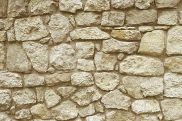 Beige stone mosaic wall background