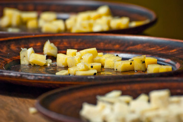 Different types of cheese on the table. Many cheese is sold at an agricultural fair. Natural home product.