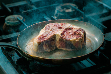 Gourmet food concept. Frying t-bone steak.