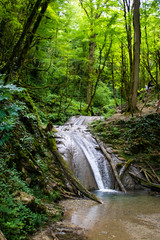 Obraz premium Picturesque waterfall in high mountains. Nature