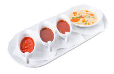 Chicken fillets and various sauces from tomato.