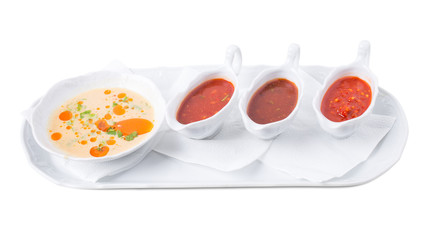 Chicken fillets and various sauces from tomato.