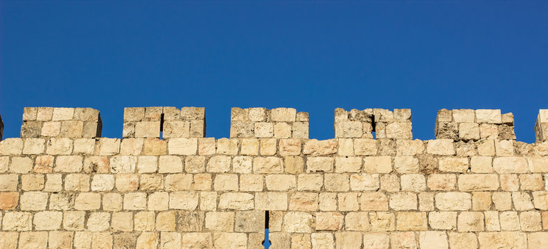 medieval castle stone wall protection construction building simple wallpaper pattern picture with blue sky background and empty space for copy or text