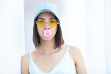 Attractive young woman on neutral white background. Pretty lady walking the city. Closeup portrait of beautiful female.