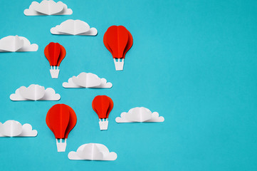 Hot air balloons in the sky paper cut and origami objects. Creative concept for banner/landing/background designs.