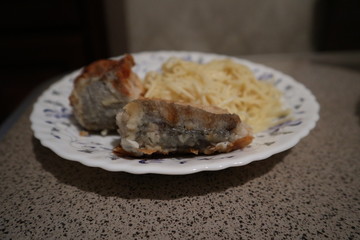 grilled fish on a plate. home food
