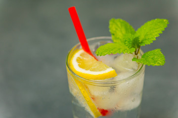 Delicious cold drink. Glass with ice cubes. Fresh icy cold cool freshening liquid. Beautiful background.