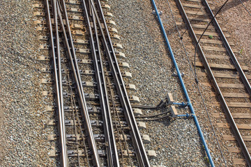 Fototapeta premium empty railway tracks with mechanisms for changing direction of movement, top view
