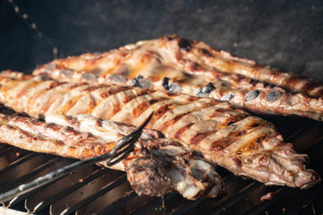 Barbecue grill with grilled pork ribs