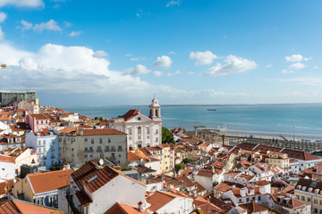 View over the roofs of the Alfama district to the Tagus river in Lisboa