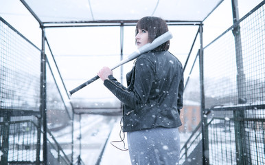 Girl in headphones listening to music outdoors