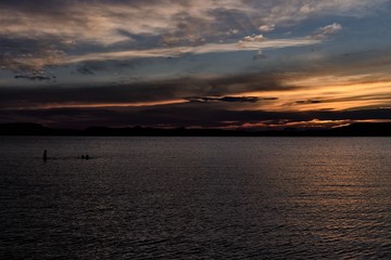 Fototapeta premium lake Balaton sunset, people silhouette, Plattensee - dark tones