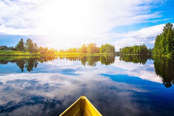 Fishing boat in a blue lake. Beautiful summer landscape in Finland