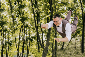 A young man in a suit and white shirt flies to his love.