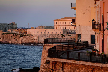 Syracuse, Ortegia, Sicily, Italy A runner in the old town at dawn.