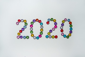 number 2020 of multi-colored, plastic, round buttons