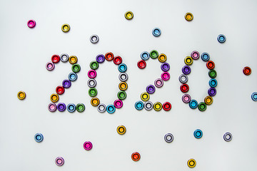 number 2020 of multi-colored, plastic, round buttons