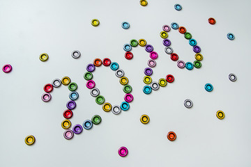 number 2020 of multi-colored, plastic, round buttons