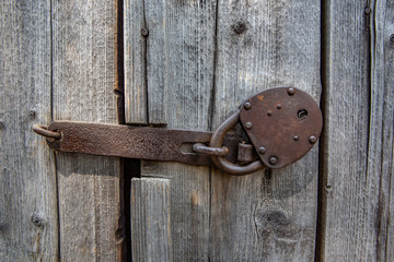 vintage padlocks and old loops against the background of textured boards