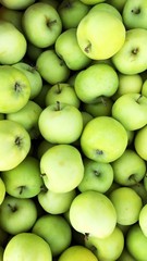 Delicious green apples in a box on the market