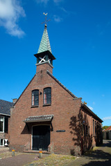 Fototapeta na wymiar Little church in historic Dutch city Sloten, Friesland