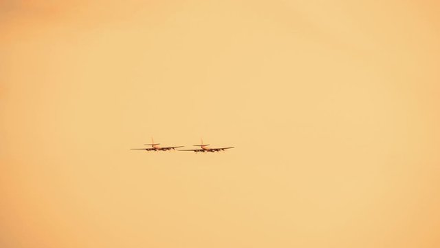 Armed russian fighter jets on the red sunset background