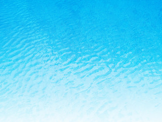 Blue background of water in swimming pool.